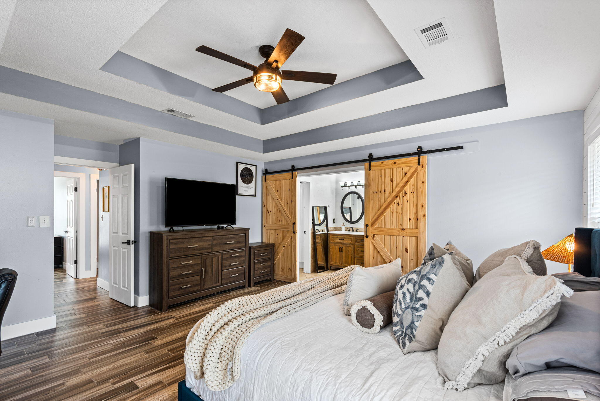 943 Ridgewood Way Niceville, FL 32578 - Photo 22 of 42 a bedroom with a bed and a flat screen tv