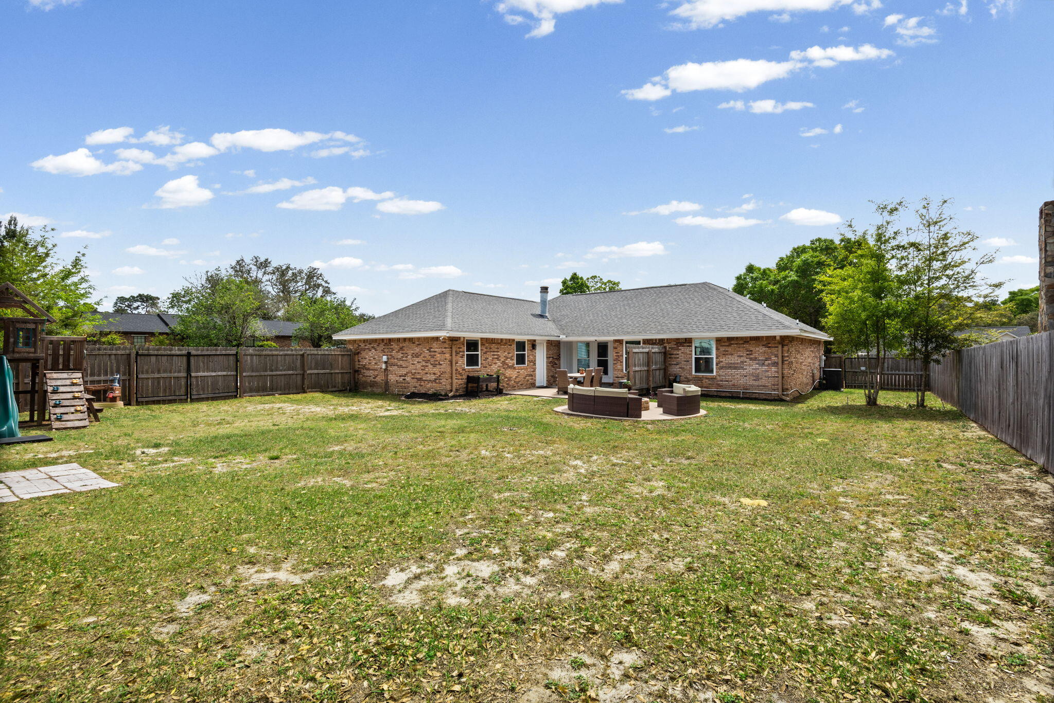 943 Ridgewood Way Niceville, FL 32578 - Photo 39 of 42 a front view of house with yard and seating