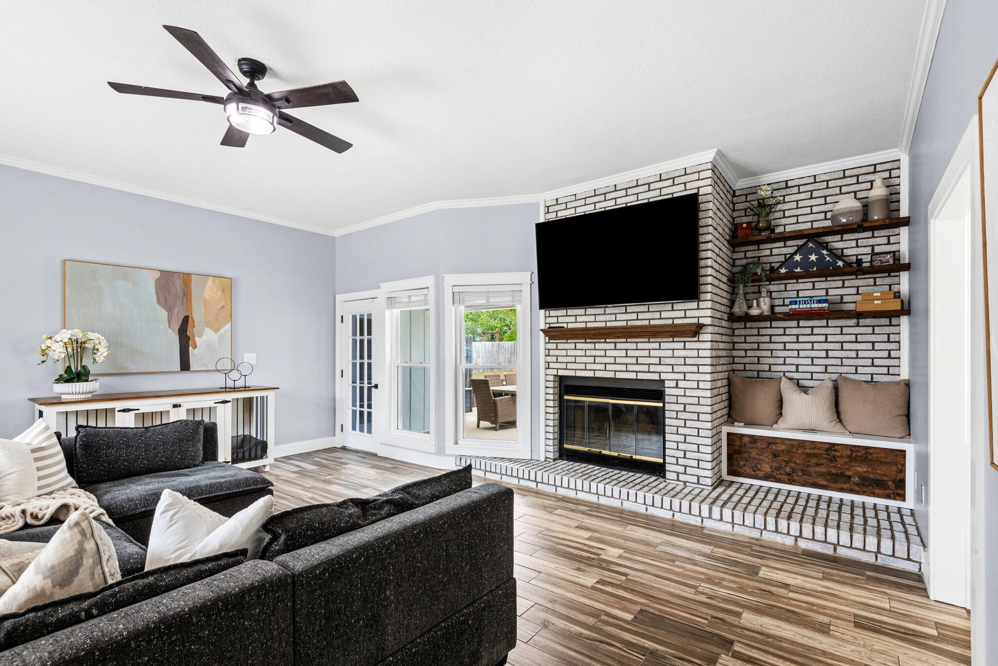 943 Ridgewood Way Niceville, FL 32578 - Photo 8 of 42 a living room with furniture a fireplace and a flat screen tv