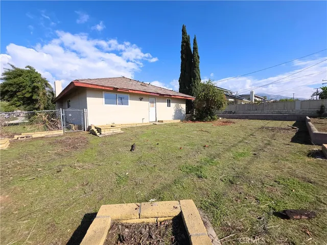 a view of swimming pool with a lounge chairs