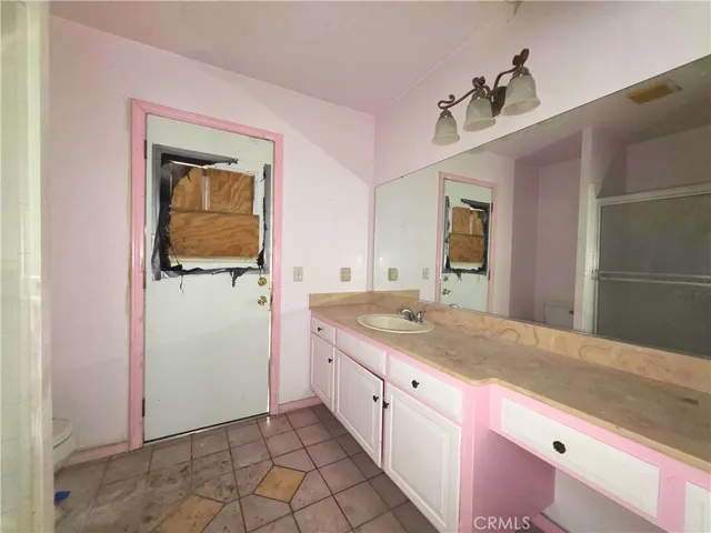 a view of an empty room and a window