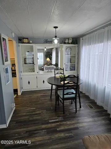 a view of a dining room with furniture