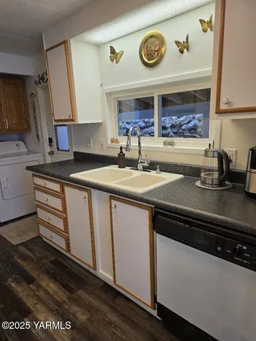 a kitchen with stainless steel appliances granite countertop a sink and cabinets