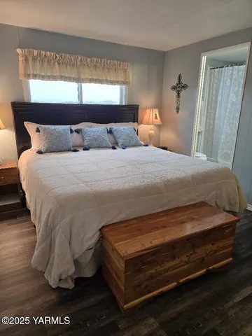 a bedroom with a bed and window