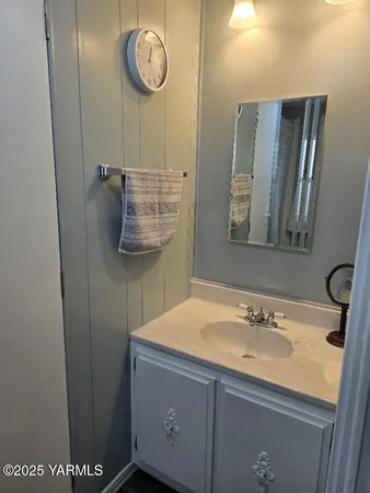 a bathroom with a sink and a mirror