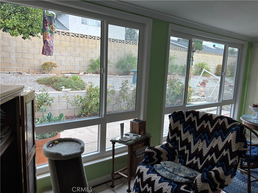 10456 Hamilton Street Rancho Cucamonga, CA 91701 - Photo 14 of 17 a living room with furniture and a large window