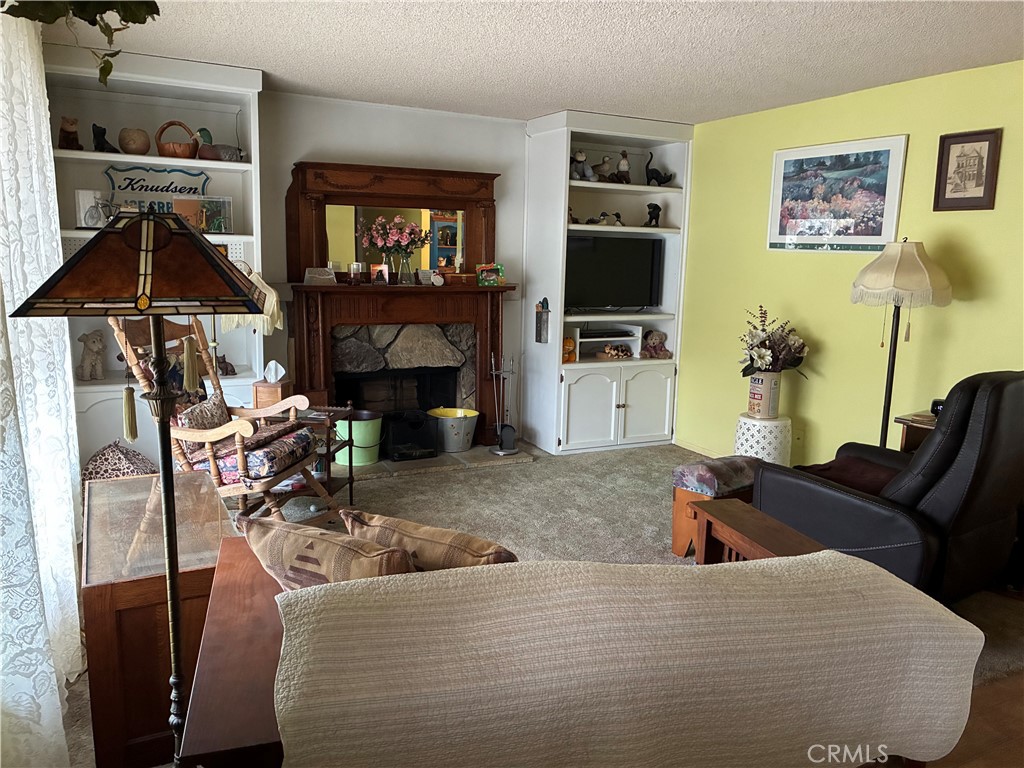 10456 Hamilton Street Rancho Cucamonga, CA 91701 - Photo 3 of 17 a living room with furniture and a flat screen tv