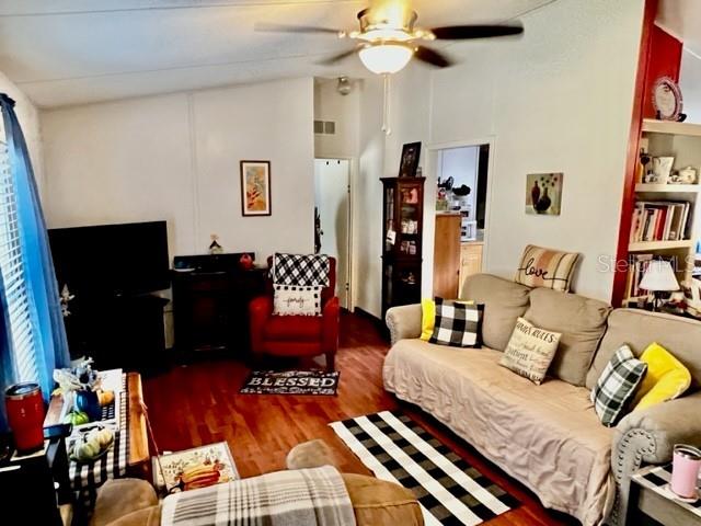 6669 Northwest 36th Lane Bell, FL 32619 - Photo 14 of 39 a living room with furniture and a flat screen tv