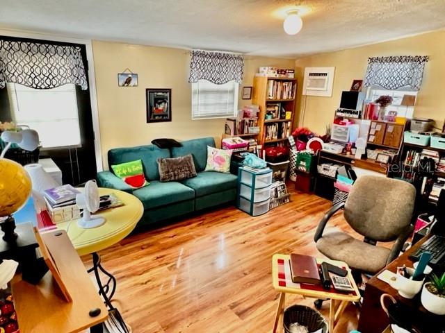 6669 Northwest 36th Lane Bell, FL 32619 - Photo 16 of 39 a living room with furniture and wooden floor