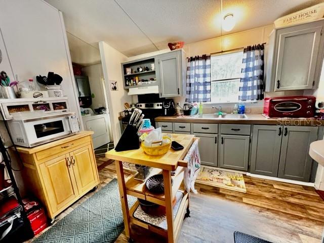 6669 Northwest 36th Lane Bell, FL 32619 - Photo 17 of 39 a kitchen with a sink appliances and cabinets