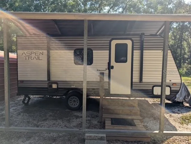 a view of house with backyard space