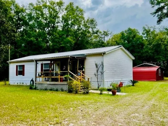 a front view of house with yard and seating area