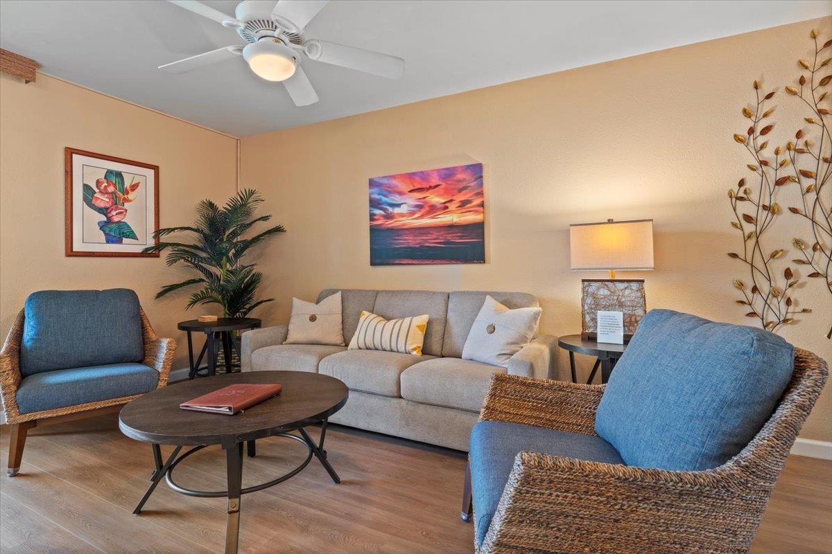 36 South Kihei Road, Unit 103 Kihei, HI 96753 - Photo 16 of 37 a living room with furniture and a lamp