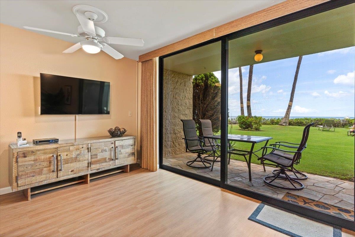 36 South Kihei Road, Unit 103 Kihei, HI 96753 - Photo 18 of 37 a living room with furniture and a flat screen tv