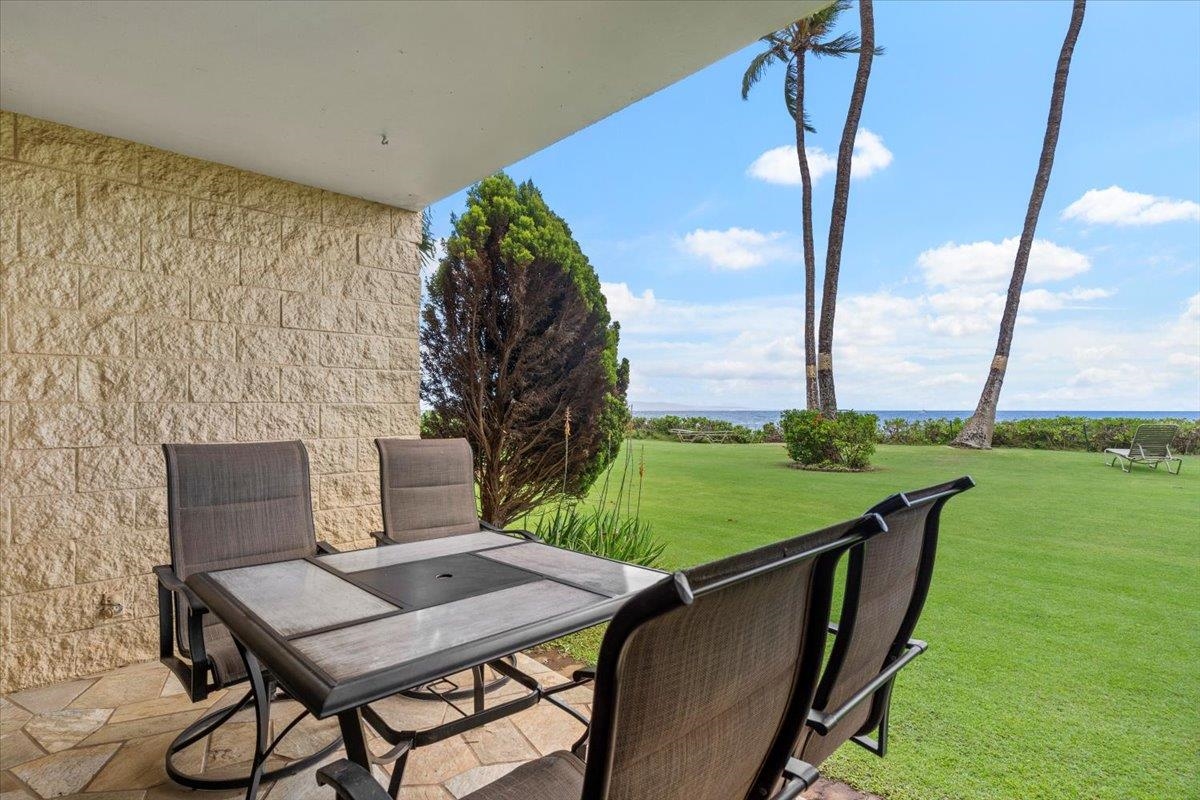36 South Kihei Road, Unit 103 Kihei, HI 96753 - Photo 24 of 37 a view of a balcony with table and chairs