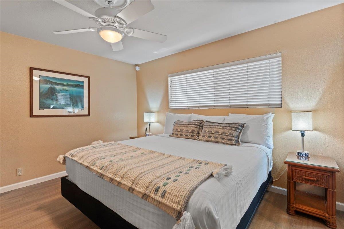 36 South Kihei Road, Unit 103 Kihei, HI 96753 - Photo 28 of 37 a bedroom with bed and a window