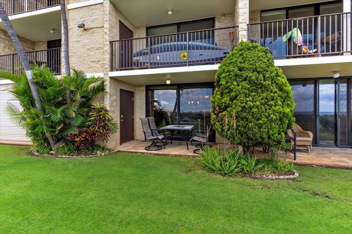 36 South Kihei Road, Unit 103 Kihei, HI 96753 - Photo 31 of 37 a view of a house with a yard and sitting area