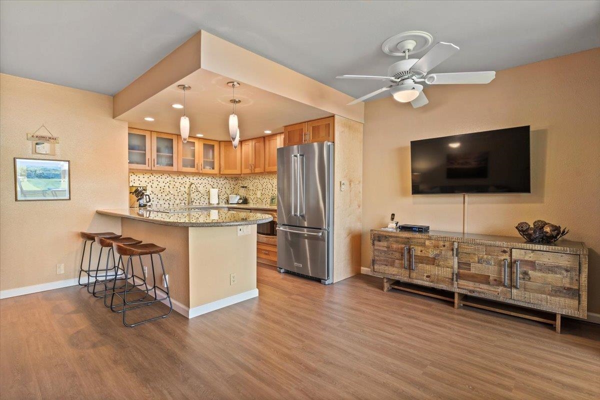 36 South Kihei Road, Unit 103 Kihei, HI 96753 - Photo 7 of 37 a living room with furniture and a flat screen tv