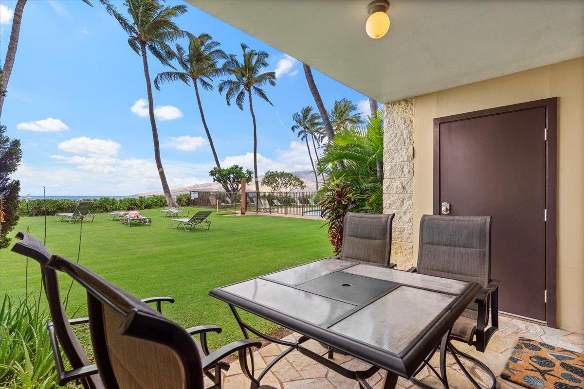 36 South Kihei Road, Unit 103 Kihei, HI 96753 - Photo 10 of 37 a view of a patio with a table and chairs