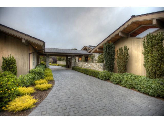 7540 Monterra Ranch Road Monterey, CA 93940 - Photo 21 of 25 a front view of a house with a yard and garage