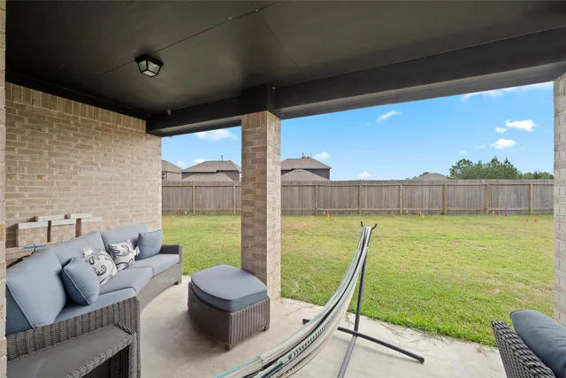 a view of a patio with a yard
