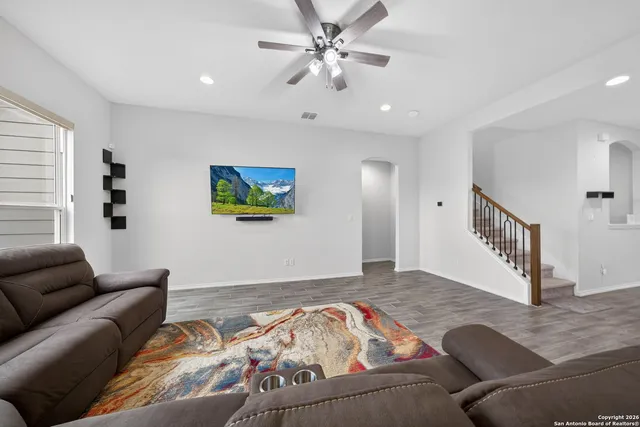 a bedroom with furniture and a window