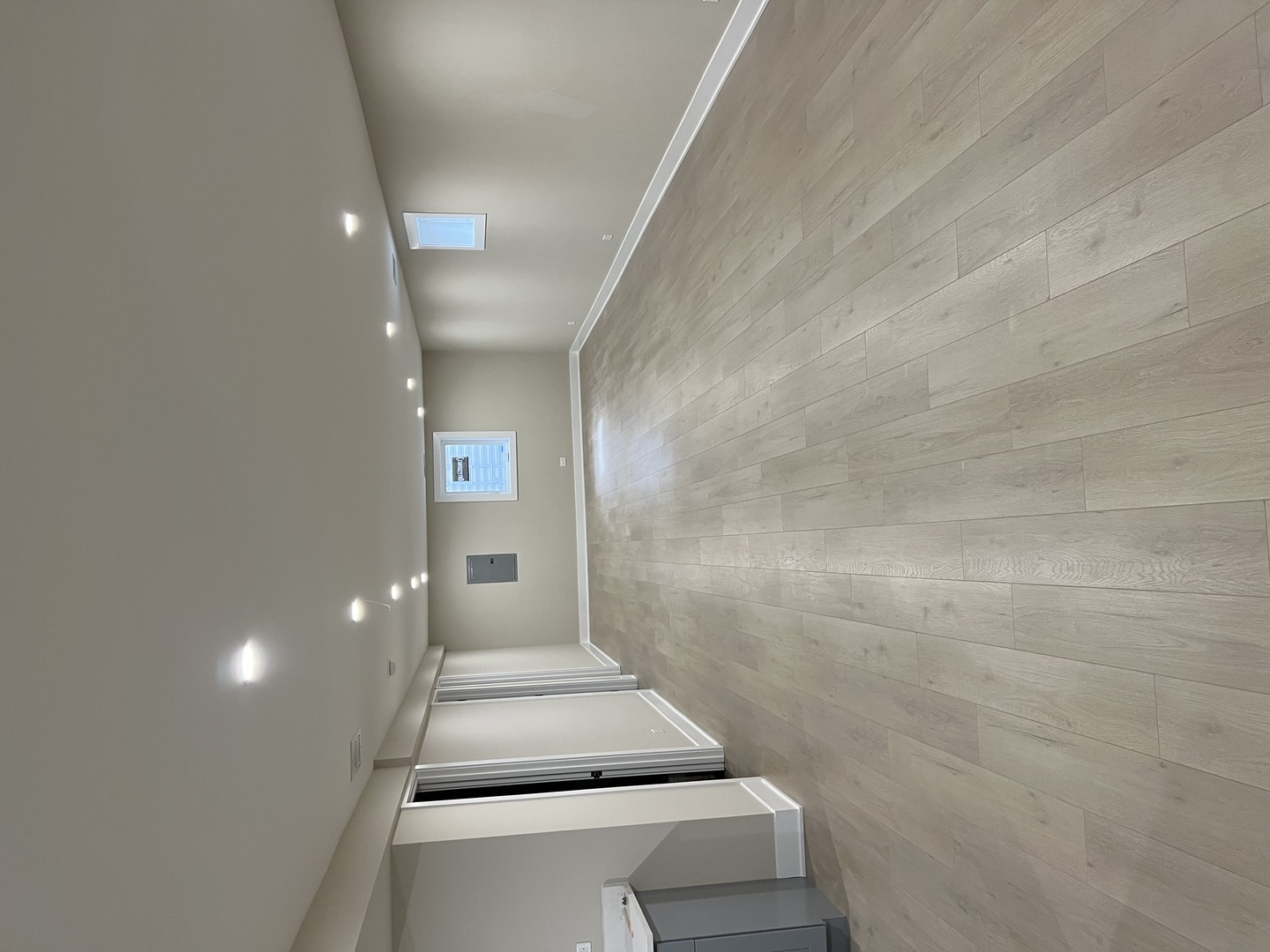 9446 Kolmar Avenue Skokie, IL 60076 - Photo 11 of 17 a view of a hallway with wooden floor and staircase