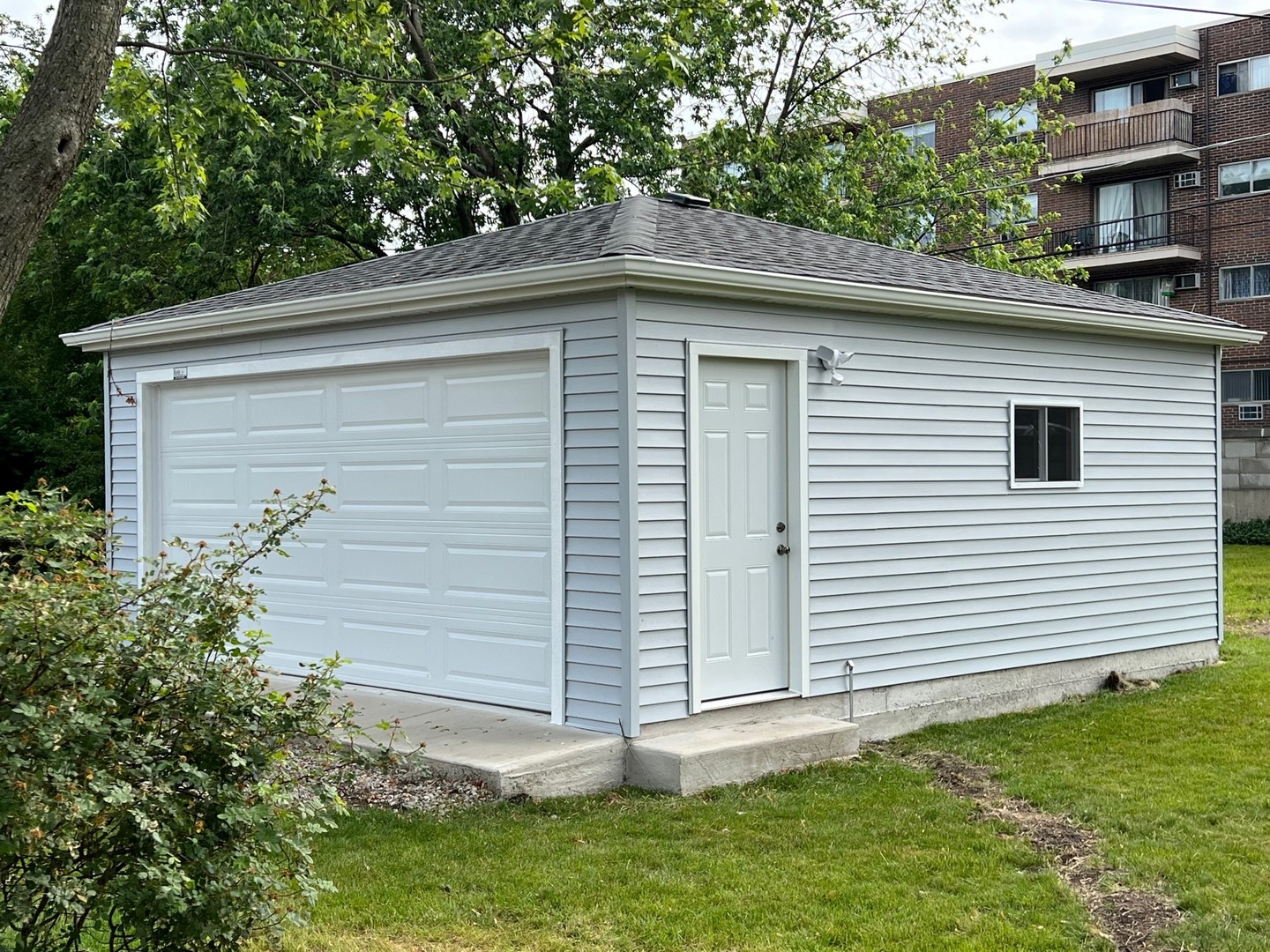 9446 Kolmar Avenue Skokie, IL 60076 - Photo 17 of 17 a front view of a house with a yard