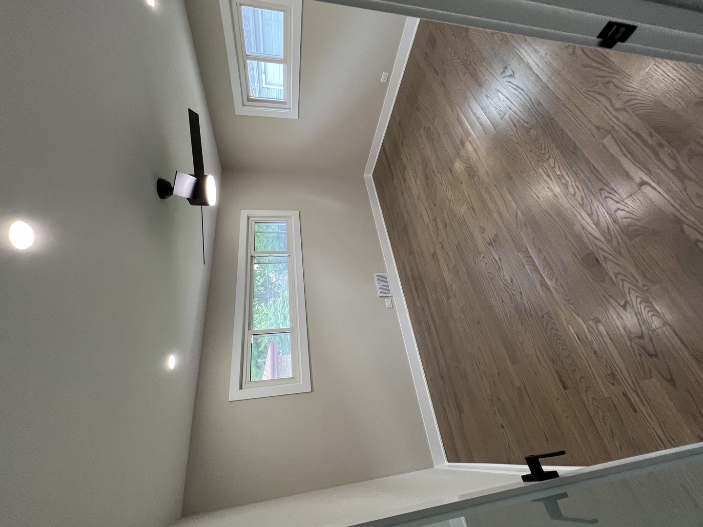 9446 Kolmar Avenue Skokie, IL 60076 - Photo 6 of 17 a view of a hallway with windows