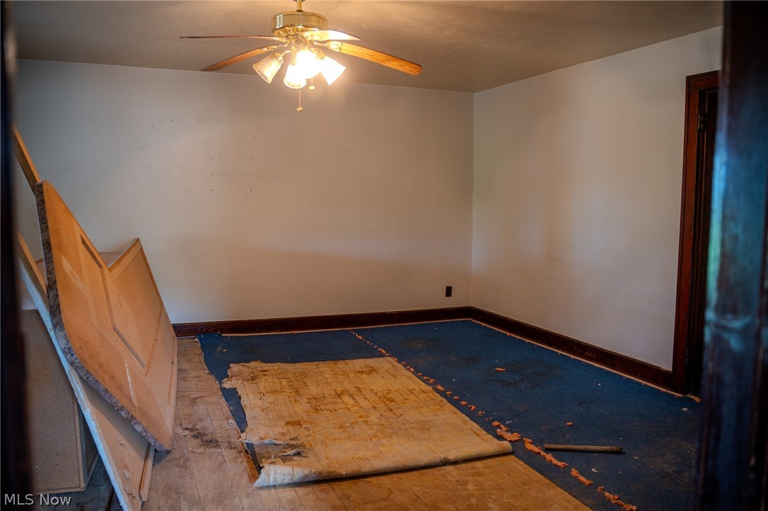 513 Ragersville Road Northwest Sugarcreek, OH 44681 - Photo 41 of 50 Empty room with ceiling fan