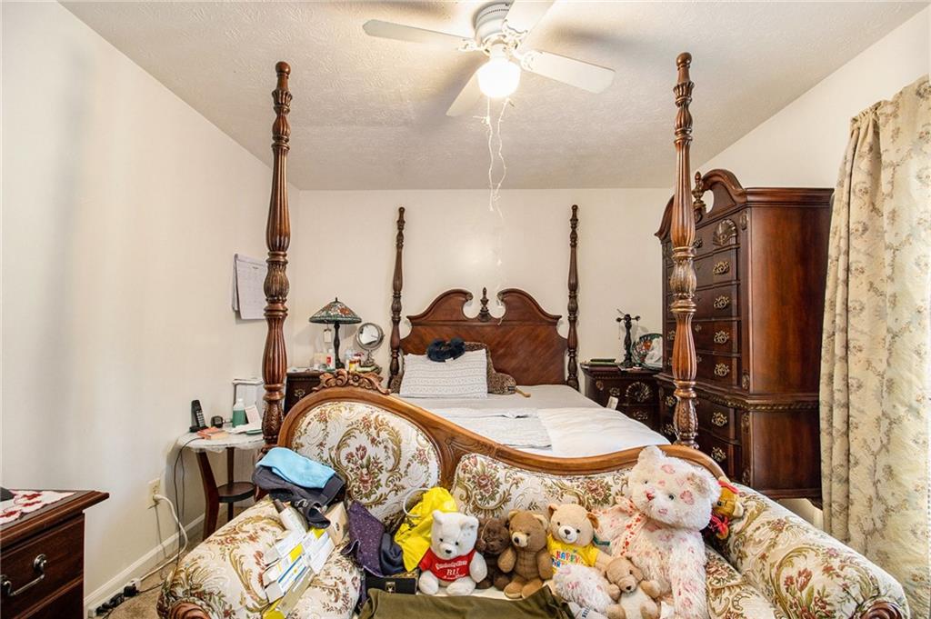 4526 Golf Vista Circle Decatur, GA 30035 - Photo 17 of 31 a room with furniture a flat screen tv and a table