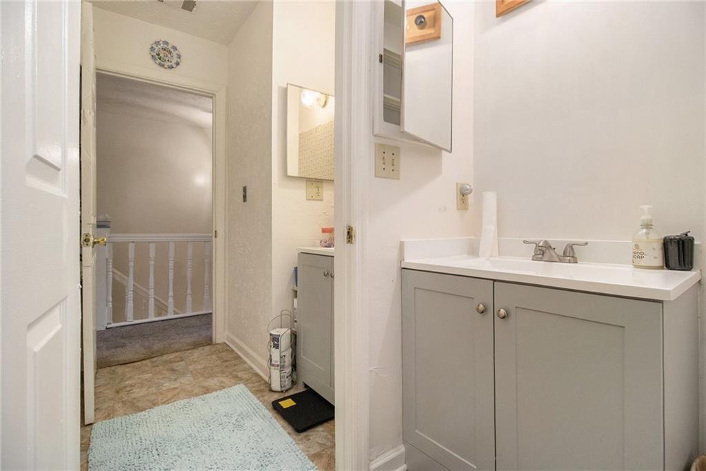 4526 Golf Vista Circle Decatur, GA 30035 - Photo 22 of 31 a bathroom with a sink and mirror