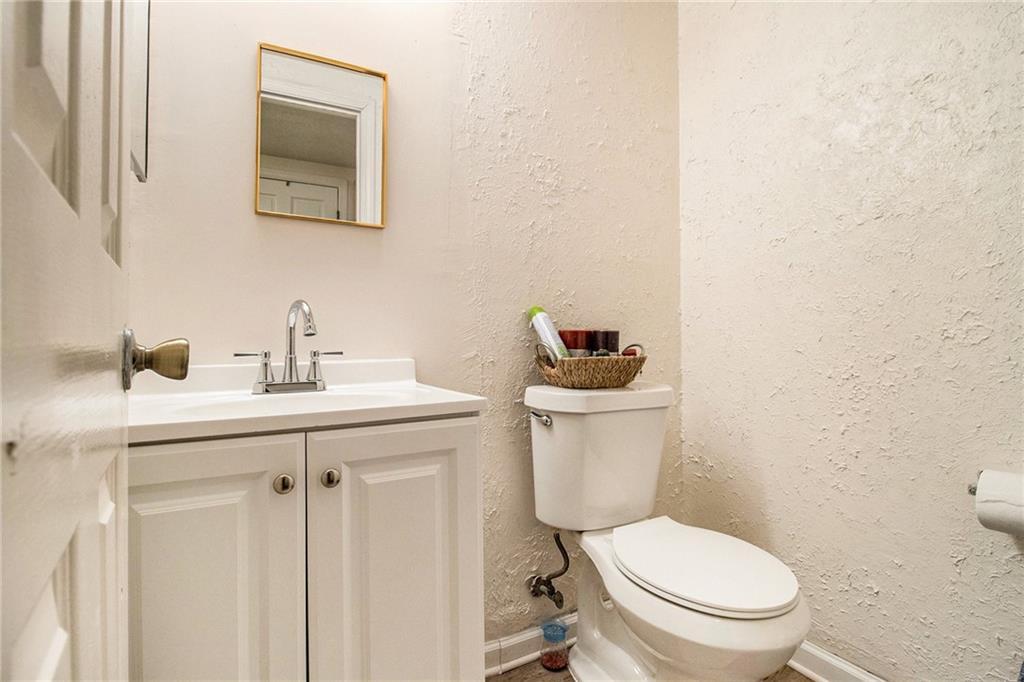 4526 Golf Vista Circle Decatur, GA 30035 - Photo 25 of 31 a bathroom with a toilet a sink and mirror