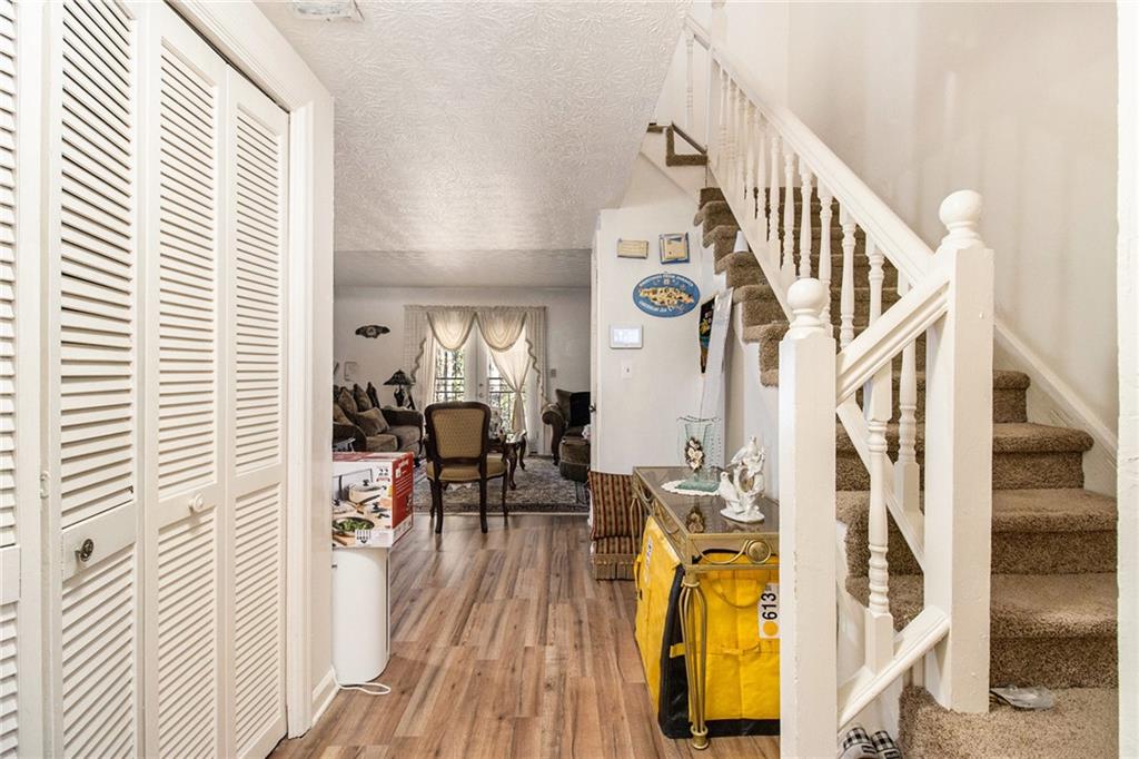 4526 Golf Vista Circle Decatur, GA 30035 - Photo 6 of 31 a view of a livingroom with wooden floor and furniture