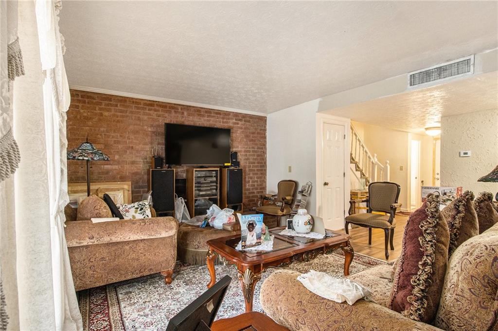 4526 Golf Vista Circle Decatur, GA 30035 - Photo 7 of 31 a living room with fireplace furniture and a fireplace