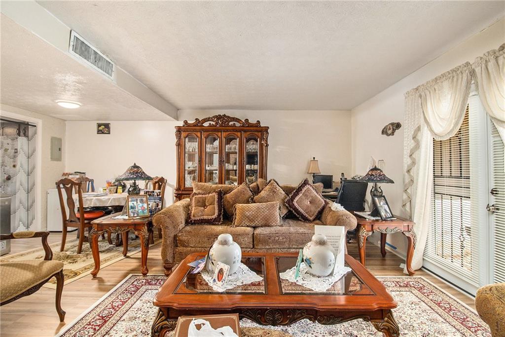 4526 Golf Vista Circle Decatur, GA 30035 - Photo 8 of 31 a living room with furniture and a wooden floor