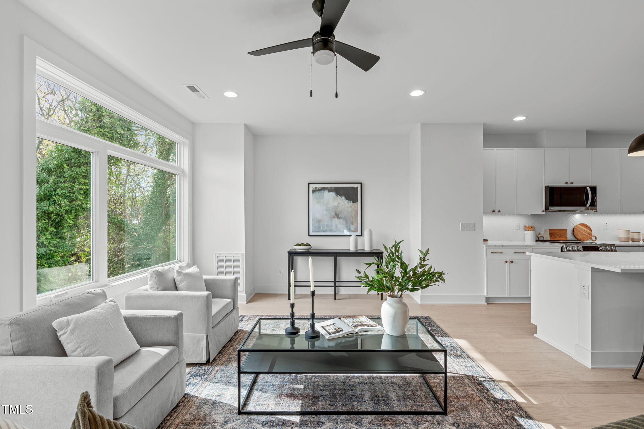 624 Rocky Knob Court Raleigh, NC 27601 - Photo 1 of 47 a living room with furniture a chandelier and a potted plant
