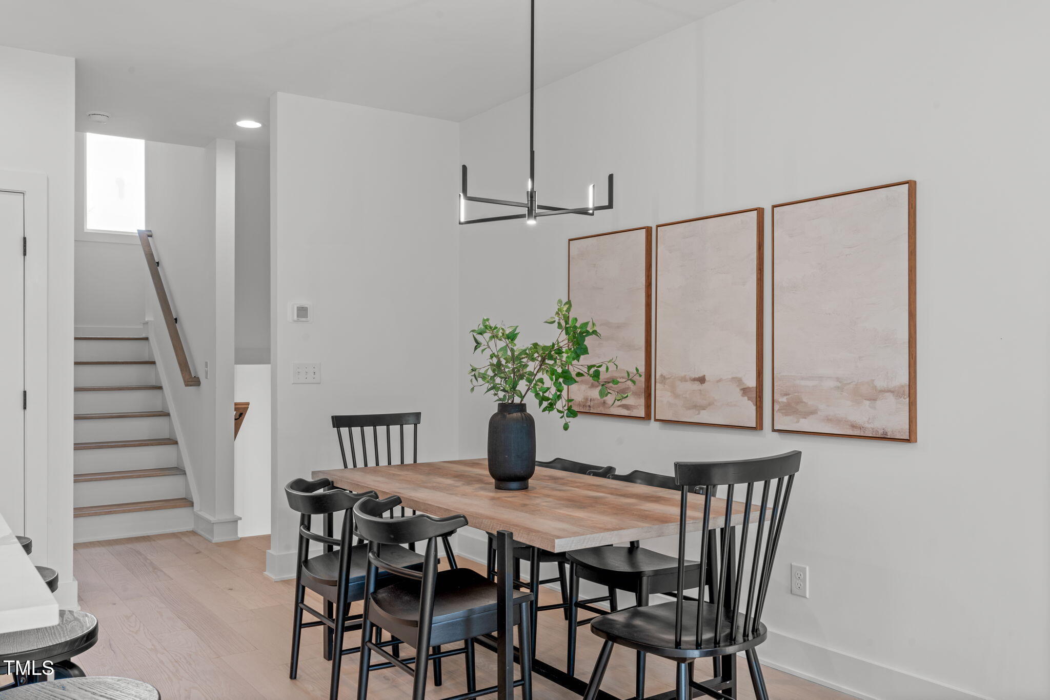 624 Rocky Knob Court Raleigh, NC 27601 - Photo 11 of 47 a view of a dining room with furniture and wooden floor