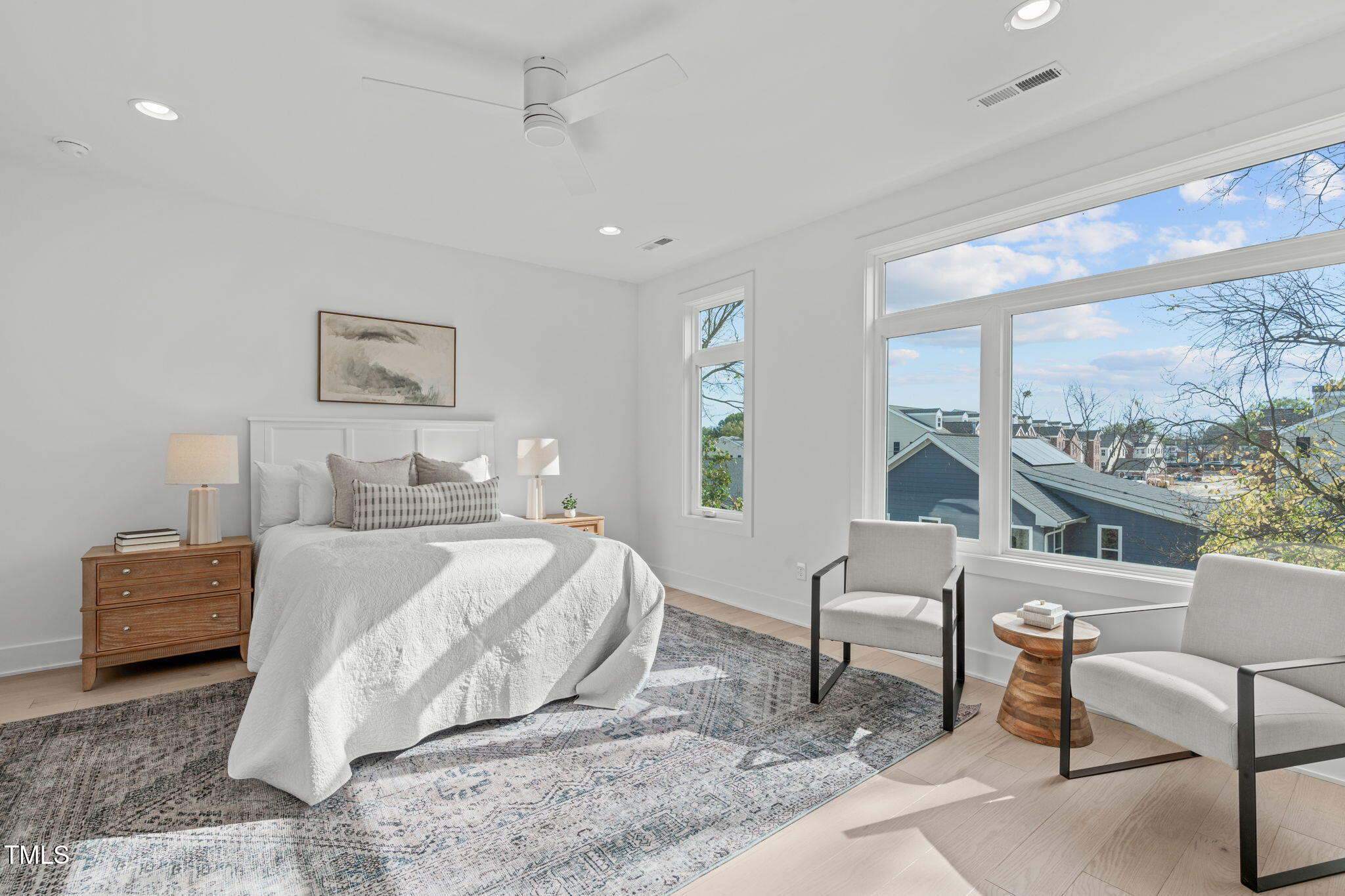 624 Rocky Knob Court Raleigh, NC 27601 - Photo 13 of 47 a bedroom with a bed a chair and next to a window
