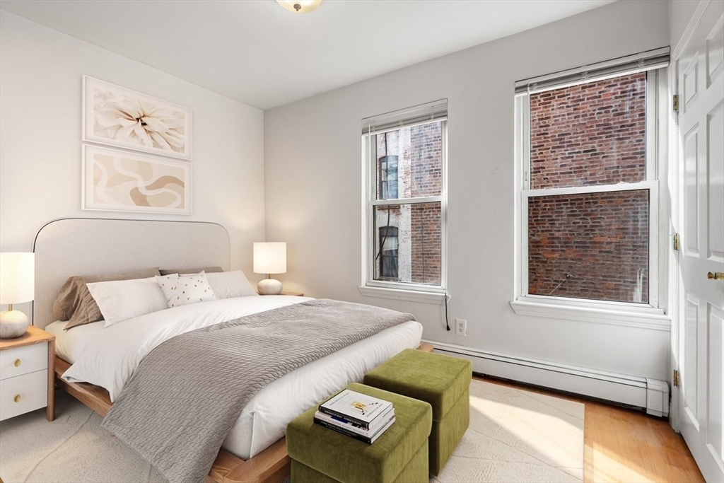 62 North Margin Street, Unit 2 Boston, MA 02113 - Photo 5 of 10 a bedroom with a bed and a window