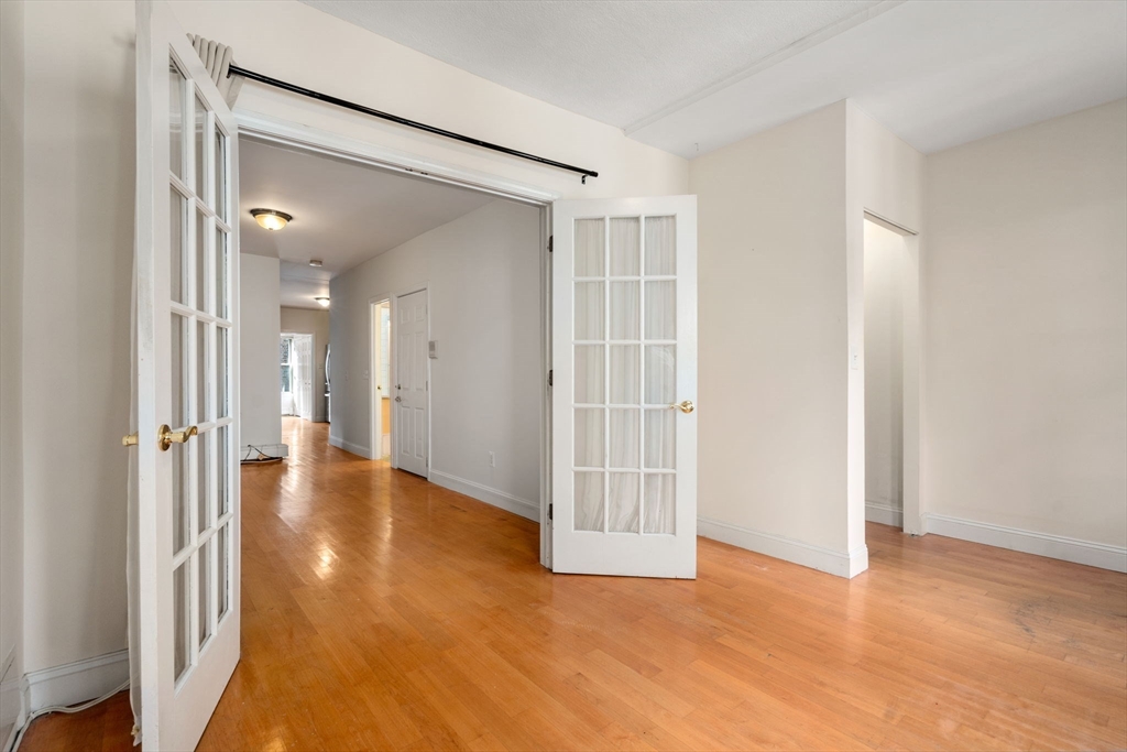 62 North Margin Street, Unit 2 Boston, MA 02113 - Photo 6 of 10 a view of a hallway with wooden floor and closet