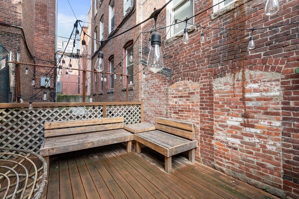 62 North Margin Street, Unit 2 Boston, MA 02113 - Photo 8 of 10 a view of a wooden roof with stairs