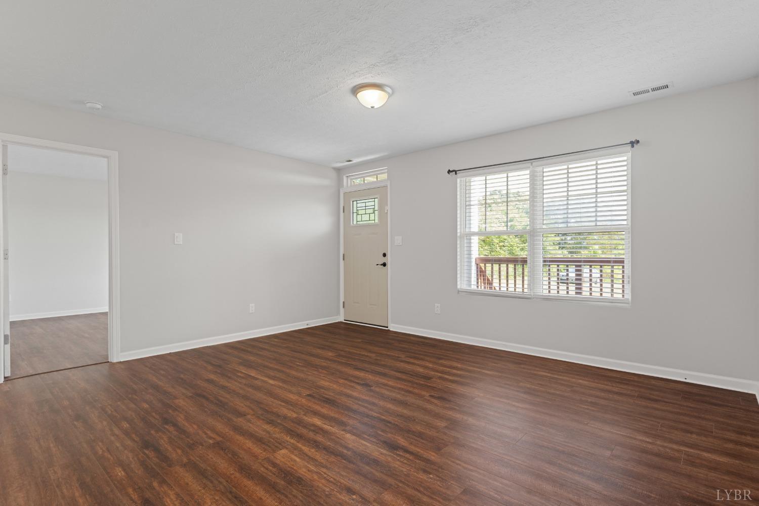 4657 Stage Road Concord, VA 24538 - Photo 18 of 29 a view of an empty room with wooden floor and a window