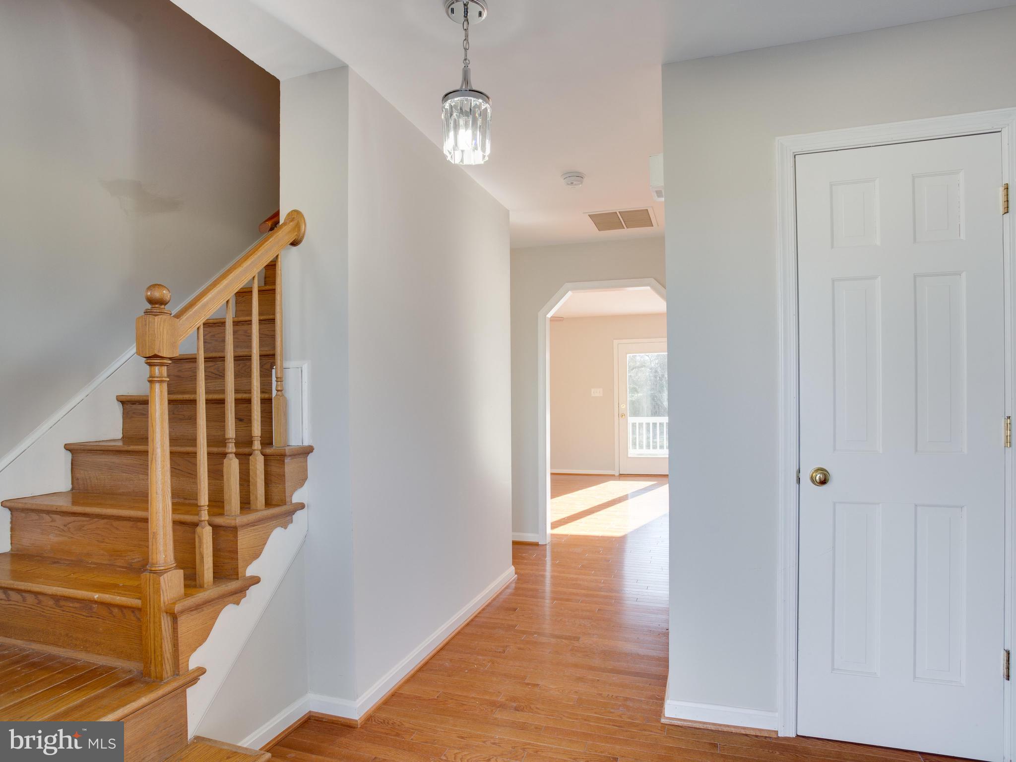 3510 Chaneyville Road Owings, MD 20736 - Photo 7 of 53 hardwood stairs and coat closet