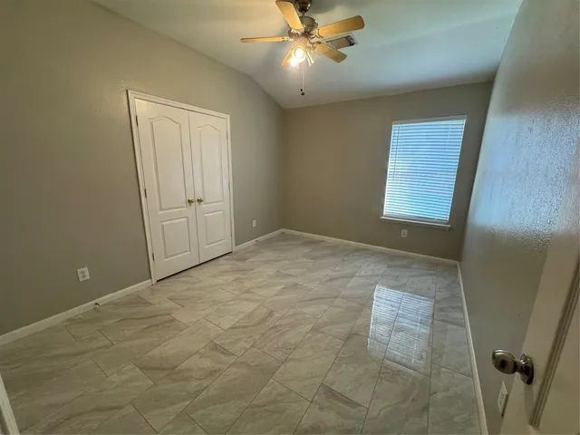 a view of an empty room and window