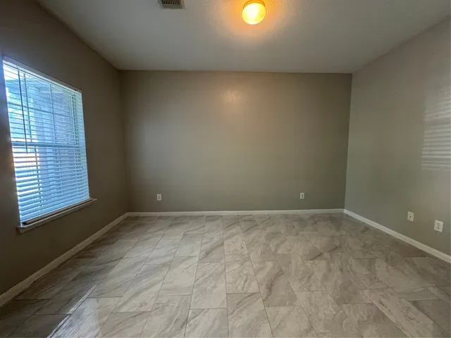 a view of a kitchen with a sink and a chandelier
