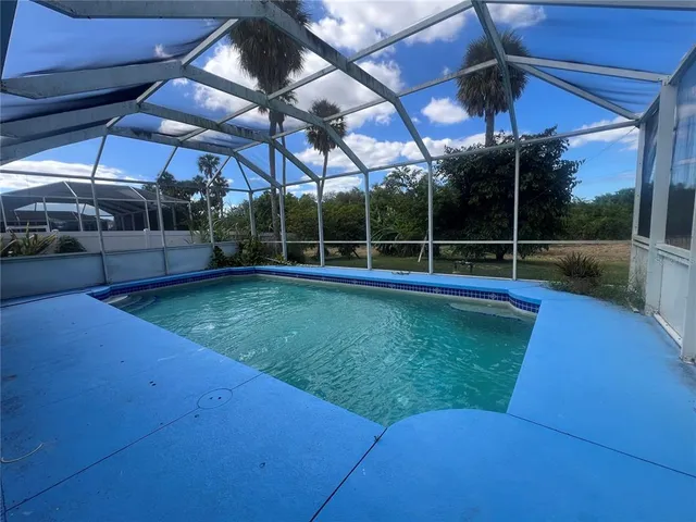 a view of a backyard with a patio and a garden