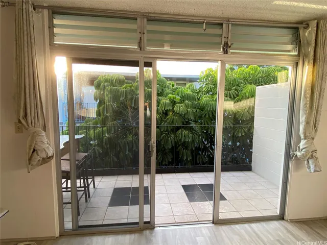 a view of a glass door with a red door