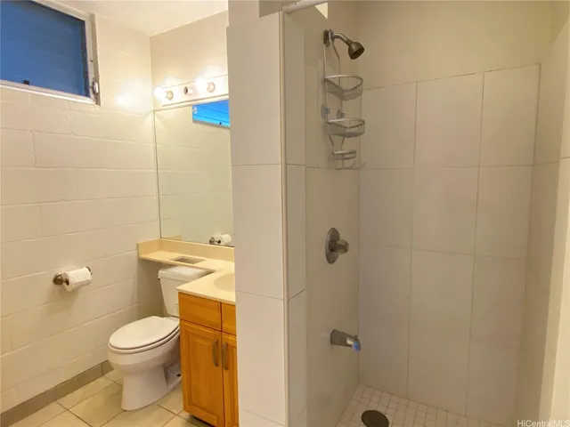 a bathroom with a toilet and shower
