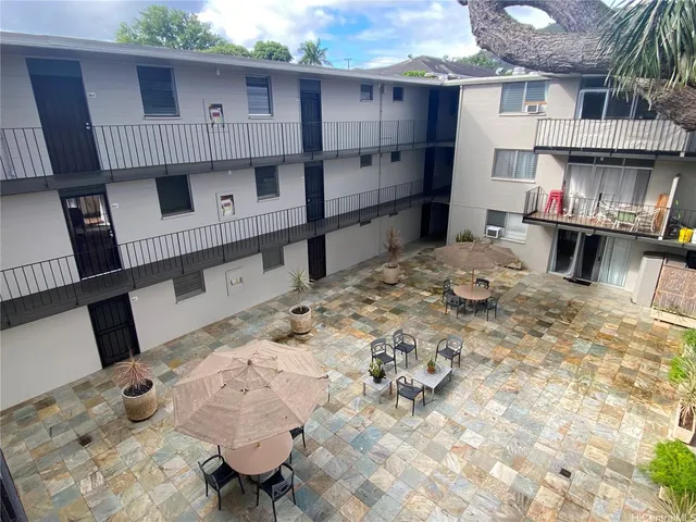 a view of kitchen with furniture and wooden floor